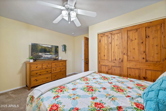 bedroom with carpet floors, a closet, ceiling fan, and baseboards