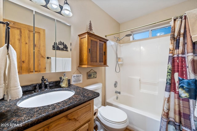 full bath featuring toilet, shower / bath combo with shower curtain, and vanity