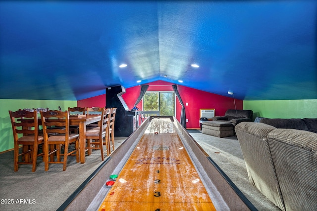 recreation room with bowling, a wall mounted AC, carpet, and lofted ceiling