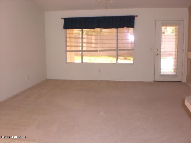 1412 E Oakland St, Gilbert, AZ 85295 - spare room featuring plenty of natural light and carpet