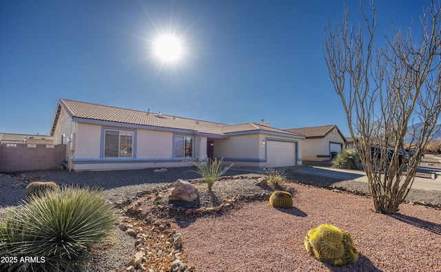 ranch-style house featuring a garage