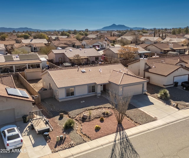 birds eye view of property with a mountain view