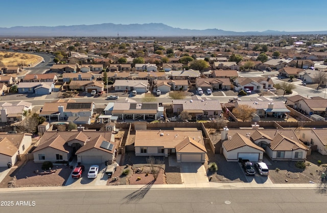 birds eye view of property featuring a mountain view