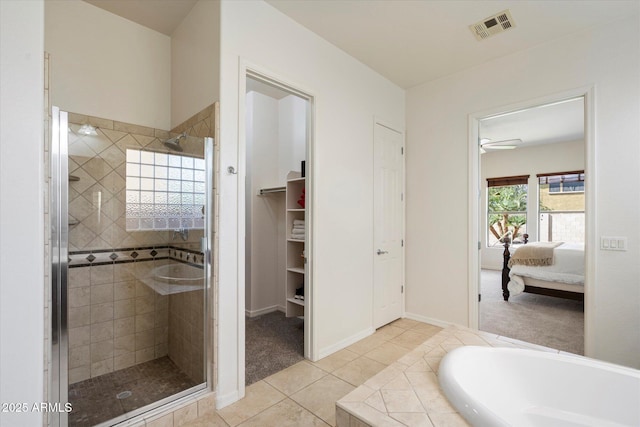43998 W Palo Abeto Dr, Maricopa, AZ 85138 - full bath featuring visible vents, baseboards, a stall shower, tile patterned floors, and ensuite bath