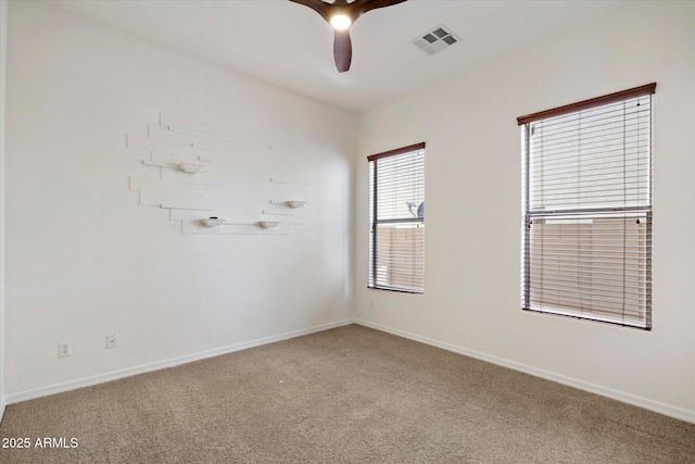 43998 W Palo Abeto Dr, Maricopa, AZ 85138 - carpeted spare room with visible vents, a ceiling fan, and baseboards
