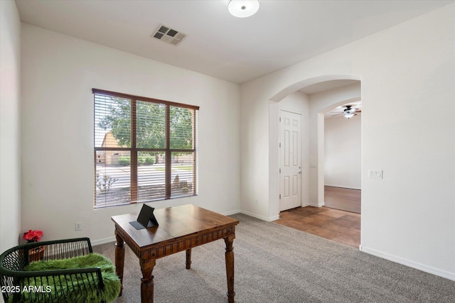 43998 W Palo Abeto Dr, Maricopa, AZ 85138 - office area with visible vents, a ceiling fan, carpet flooring, baseboards, and arched walkways