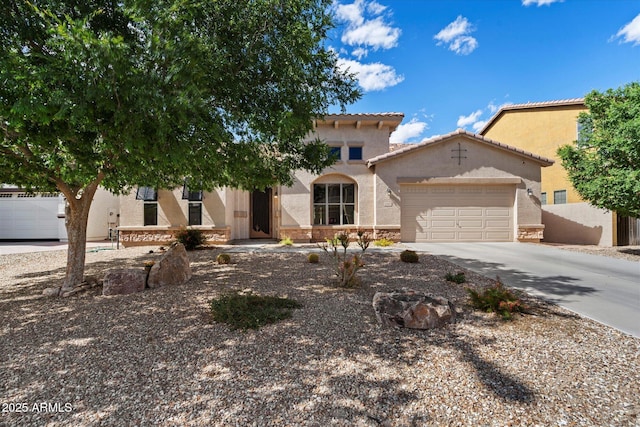 43998 W Palo Abeto Dr, Maricopa, AZ 85138 - mediterranean / spanish-style home featuring a tiled roof, an attached garage, driveway, and stucco siding