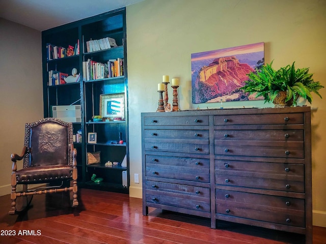 living area with hardwood / wood-style flooring