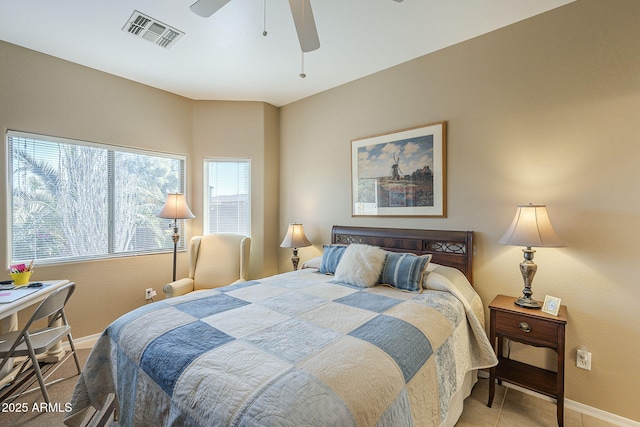 bedroom featuring multiple windows and ceiling fan