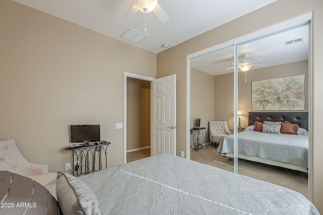 tiled bedroom featuring ceiling fan