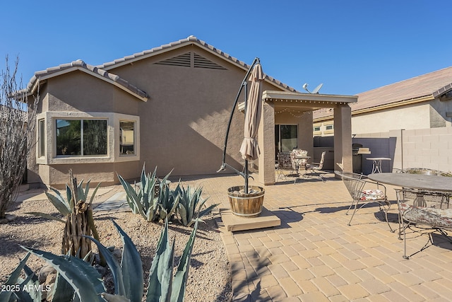 rear view of house with a patio area