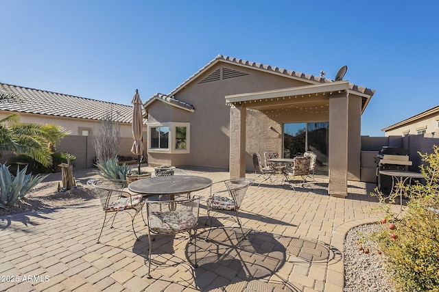 back of house featuring a patio area