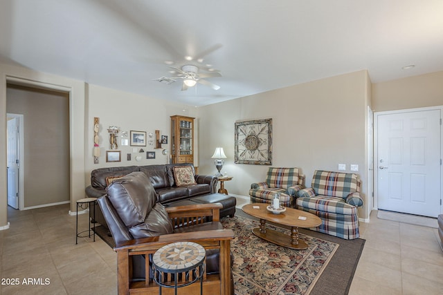 tiled living room featuring ceiling fan