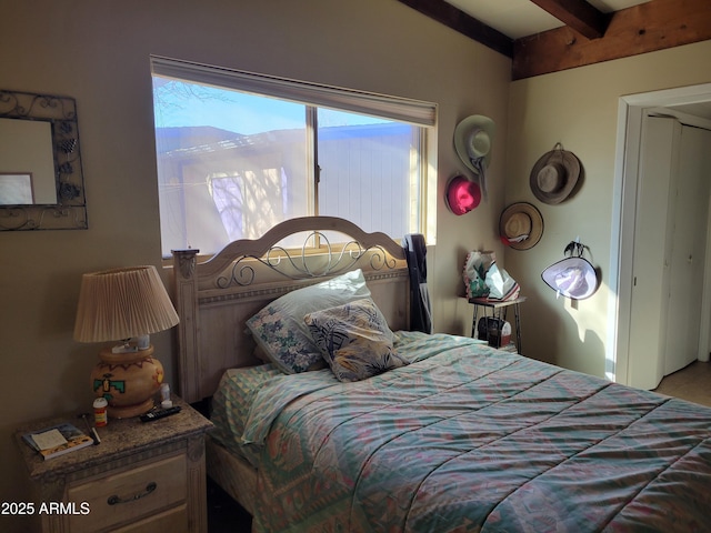 bedroom featuring beam ceiling