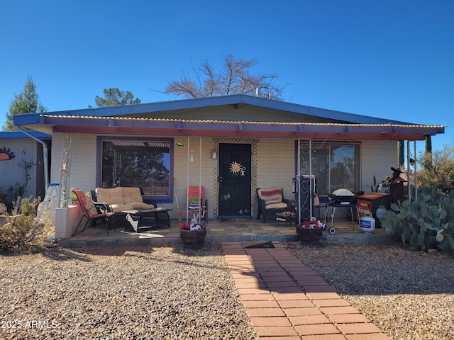 view of front of home featuring a patio