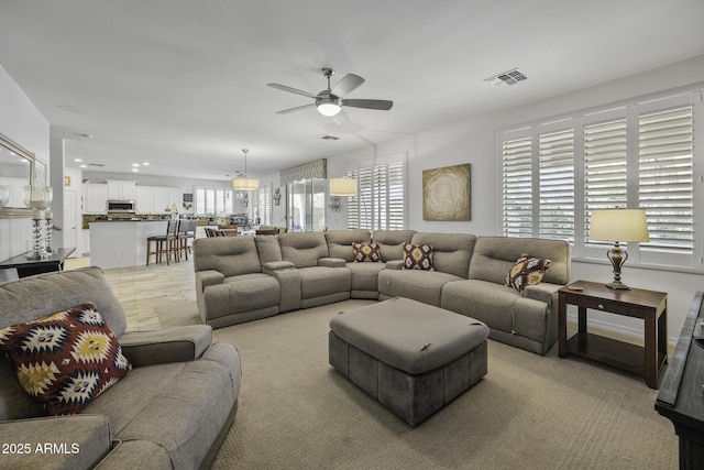 43650 W Snow Dr, Maricopa, AZ 85138 - living room featuring a ceiling fan and visible vents