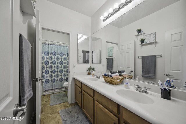43650 W Snow Dr, Maricopa, AZ 85138 - full bathroom featuring double vanity, a sink, toilet, and curtained shower