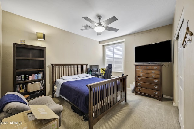 43650 W Snow Dr, Maricopa, AZ 85138 - bedroom with baseboards, visible vents, a ceiling fan, and light carpet