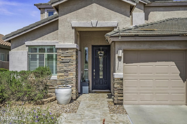 43650 W Snow Dr, Maricopa, AZ 85138 - entrance to property with stone siding, a garage, and stucco siding