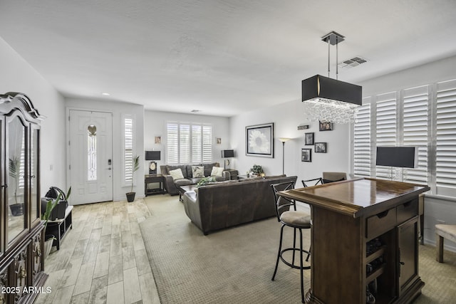 43650 W Snow Dr, Maricopa, AZ 85138 - living room with recessed lighting, light wood finished floors, and visible vents