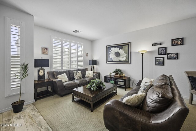 43650 W Snow Dr, Maricopa, AZ 85138 - living area with baseboards, visible vents, and light wood finished floors