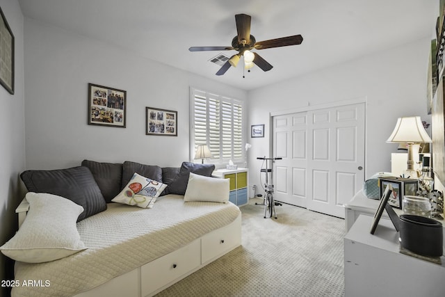43650 W Snow Dr, Maricopa, AZ 85138 - bedroom featuring light carpet, visible vents, a closet, and a ceiling fan