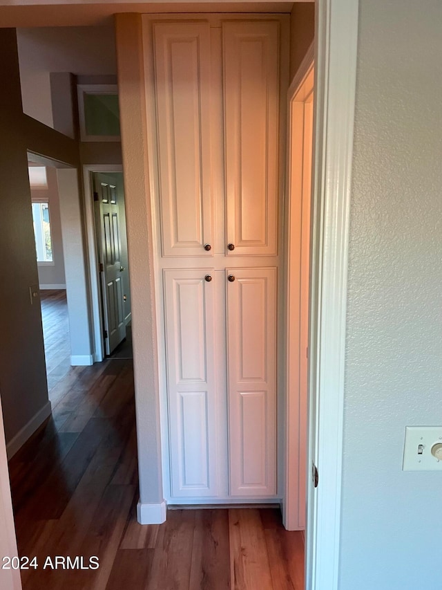 hallway featuring dark hardwood / wood-style floors