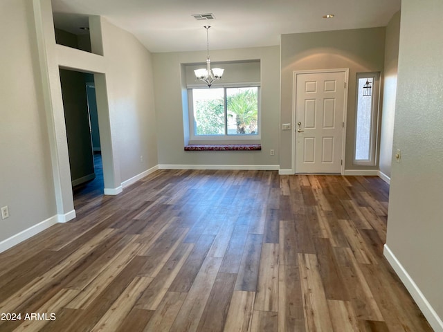 interior space featuring a notable chandelier and dark hardwood / wood-style floors