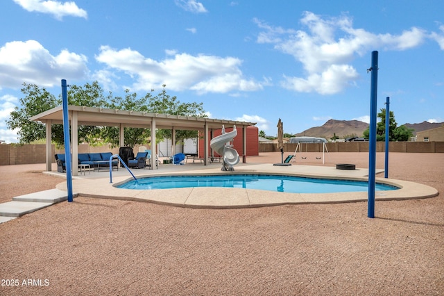 2926 W Smoketree St, Apache Junction, AZ 85120 - view of swimming pool with a patio area, a water slide, a fenced backyard, and an outdoor living space