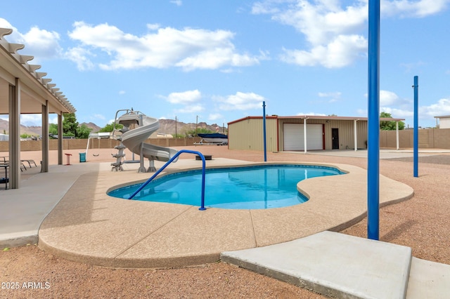 2926 W Smoketree St, Apache Junction, AZ 85120 - view of swimming pool featuring a water slide and a patio area