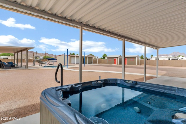 2926 W Smoketree St, Apache Junction, AZ 85120 - view of patio with a hot tub and a residential view