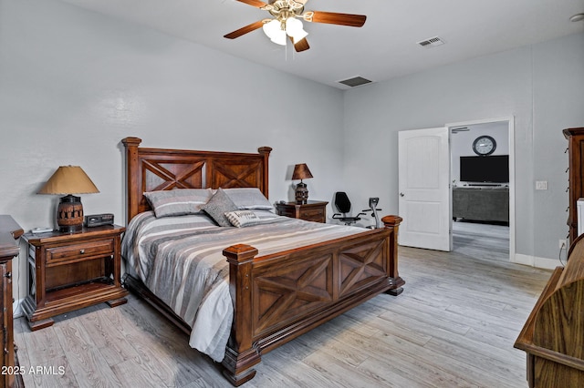2926 W Smoketree St, Apache Junction, AZ 85120 - bedroom with light wood finished floors, a ceiling fan, and baseboards