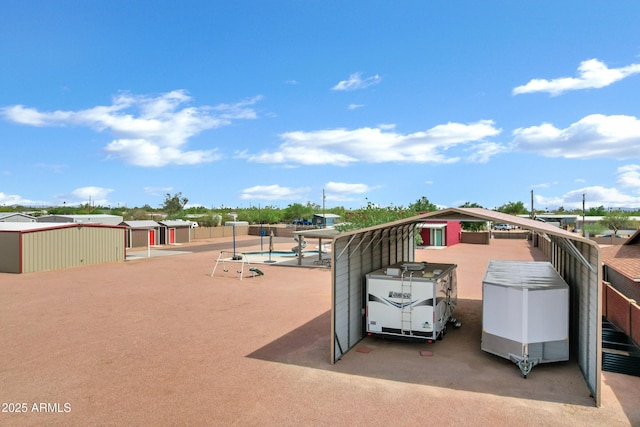 2926 W Smoketree St, Apache Junction, AZ 85120 - view of patio with a community pool and a detached carport