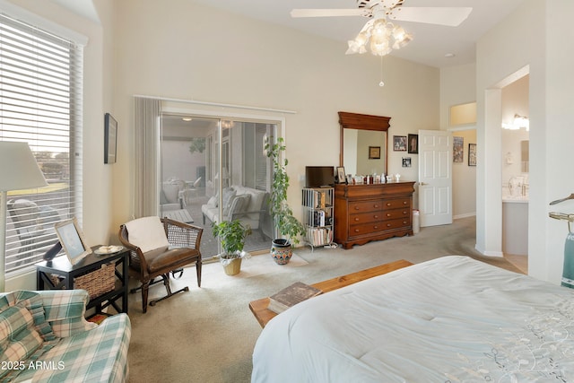 carpeted bedroom with ceiling fan, high vaulted ceiling, and access to outside