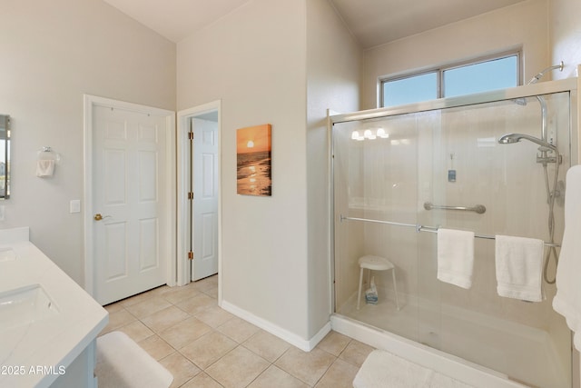 bathroom featuring vanity, an enclosed shower, and tile patterned flooring