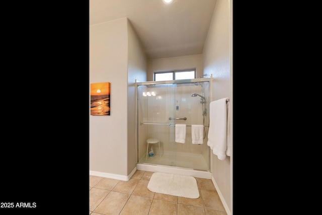 bathroom with tile patterned floors and walk in shower