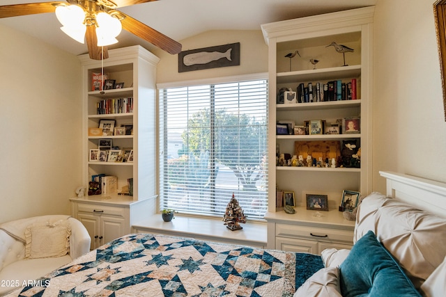 bedroom featuring vaulted ceiling and multiple windows