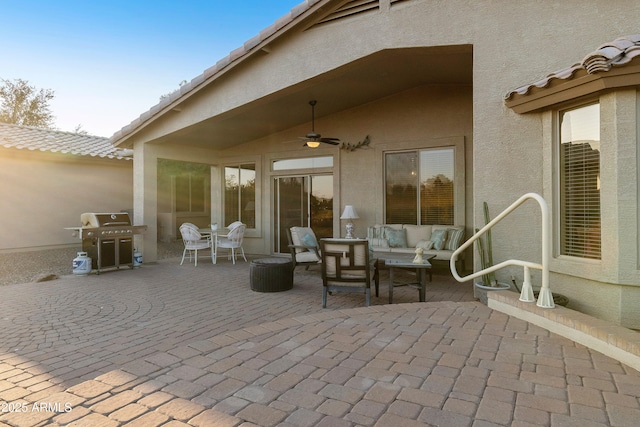 view of patio featuring an outdoor living space, grilling area, and ceiling fan