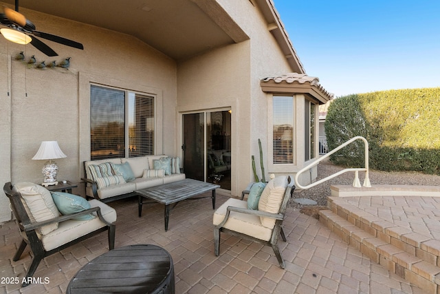 view of patio featuring ceiling fan and an outdoor living space