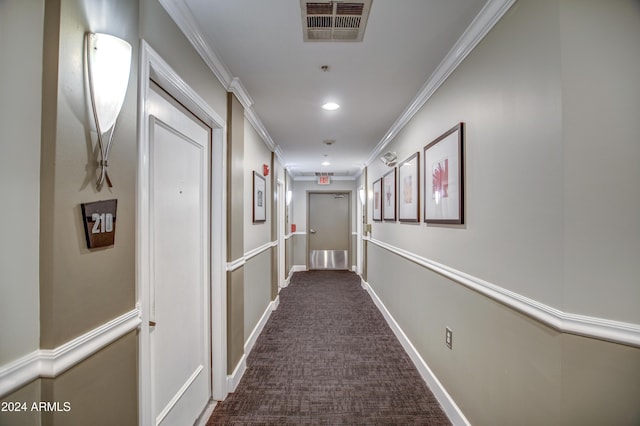 corridor with dark carpet and ornamental molding