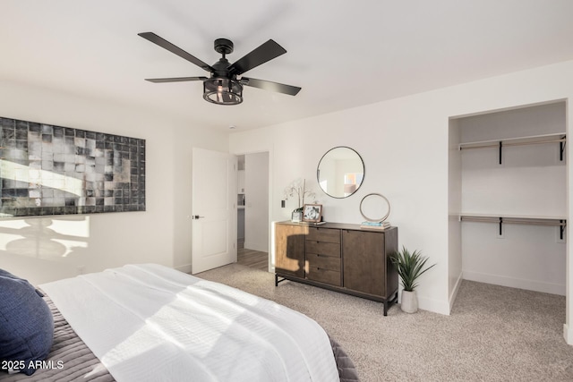 bedroom featuring light colored carpet and ceiling fan