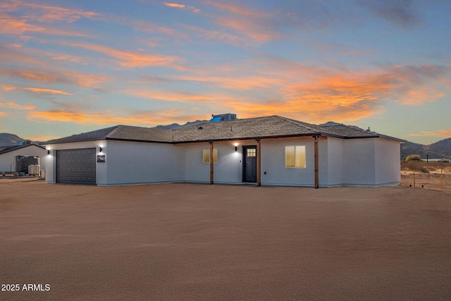 prairie-style home featuring a garage