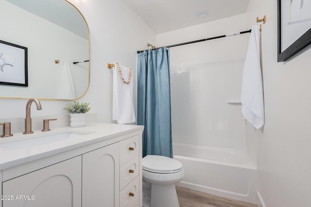 full bathroom featuring shower / bath combination with curtain, wood-type flooring, toilet, and vanity