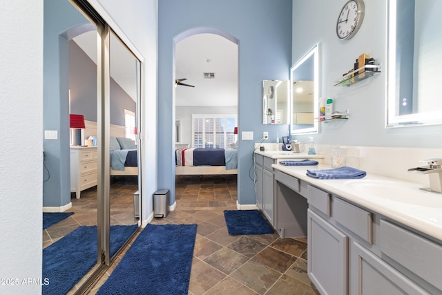 bathroom featuring ceiling fan and vanity