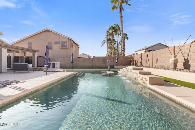 view of pool featuring pool water feature and a patio area