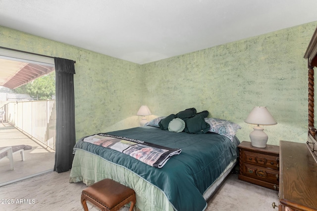 bedroom featuring access to outside and light colored carpet