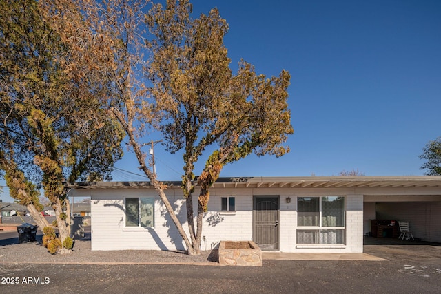 ranch-style home with a carport