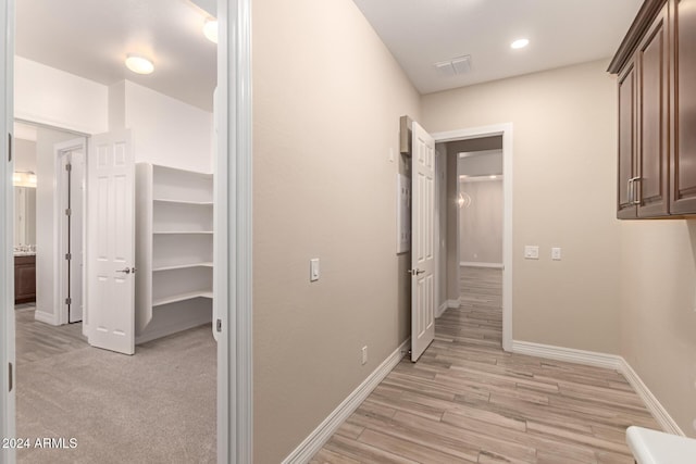 hall with light wood-type flooring