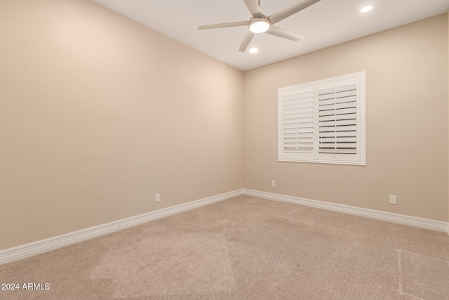 carpeted empty room with ceiling fan