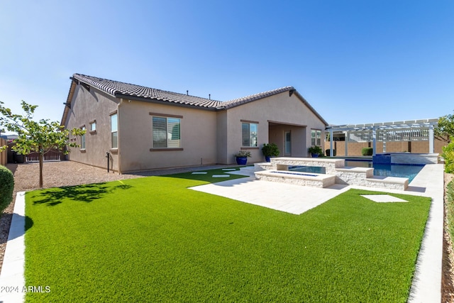 back of property with a pergola, a patio area, a yard, and a pool with hot tub